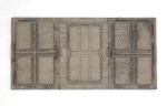 This shows a wall mounted sculpture, rectangular landscape format with 3 sections, each with rectangular shaped relief shapes. The sculpture is made from cast concrete, using polystyrene packaging as a mould.